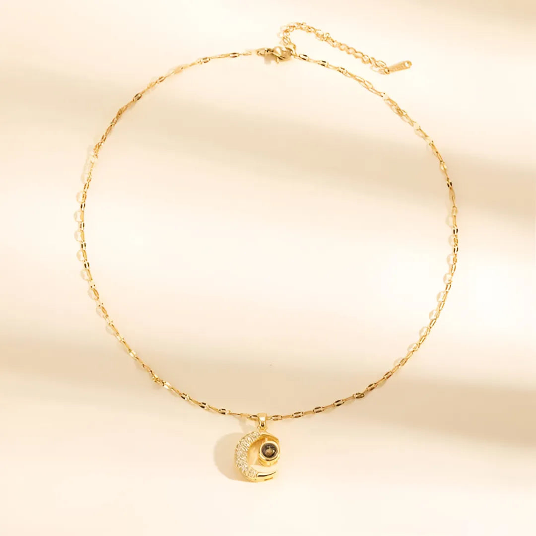 COLLAR LUNA PROYECTA FRASE TE AMO EN 100 IDIOMAS